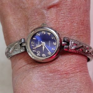Monica faux silver watch.